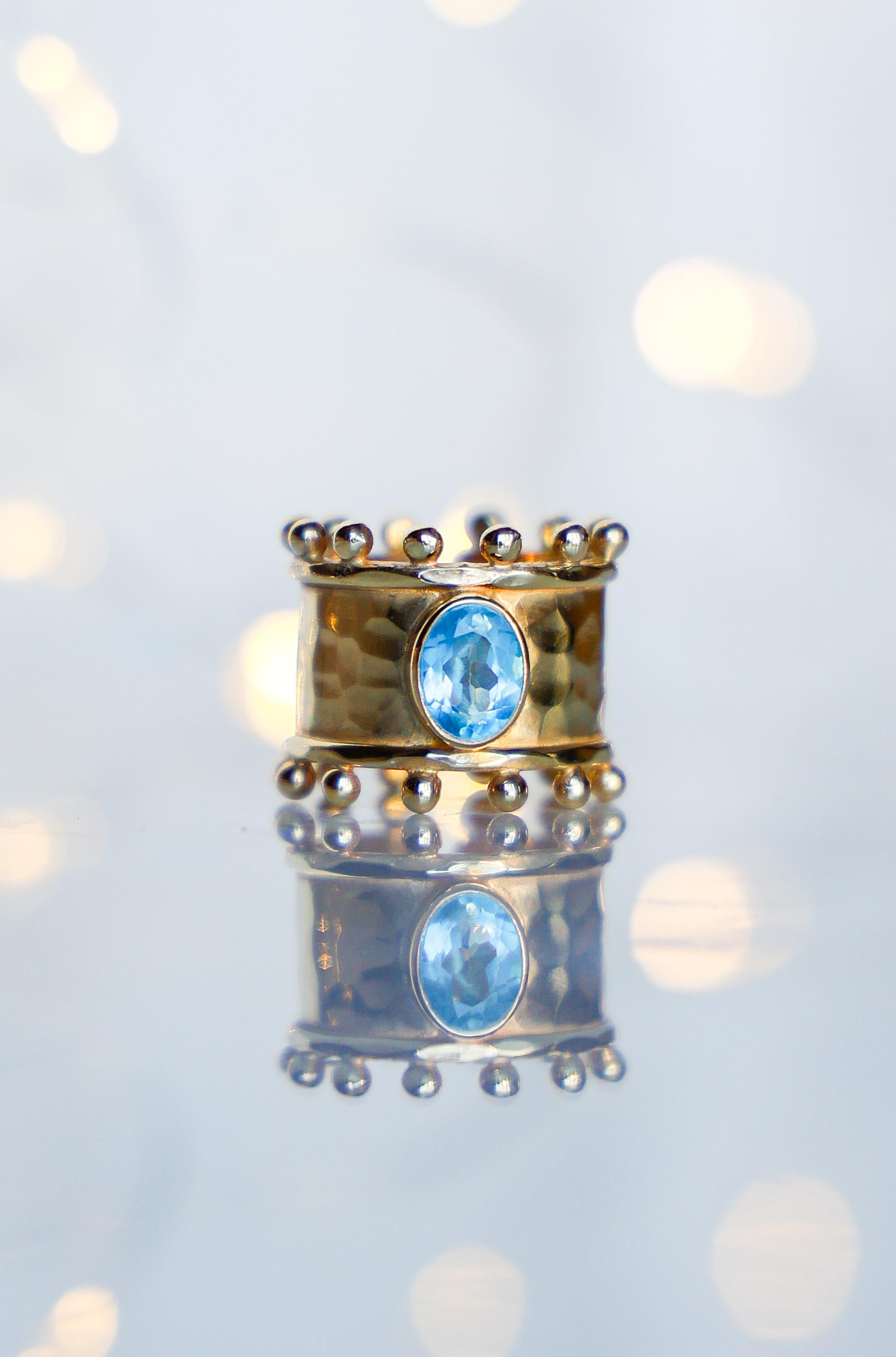 ANILLO ETER GOLD Y SWISS TOPACIO CELESTE