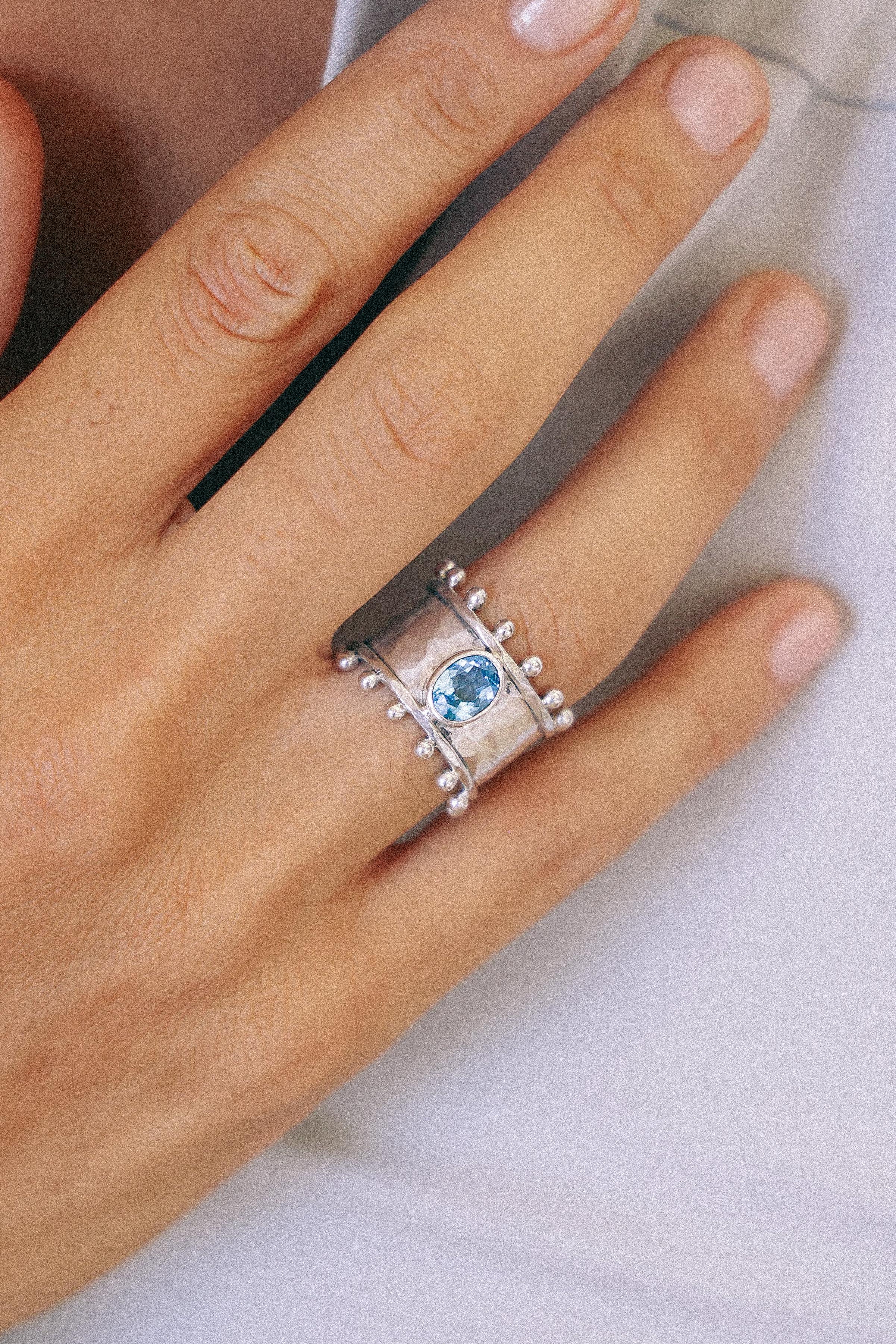 ANILLO ETER DE PLATA Y SWISS TOPACIO CELESTE