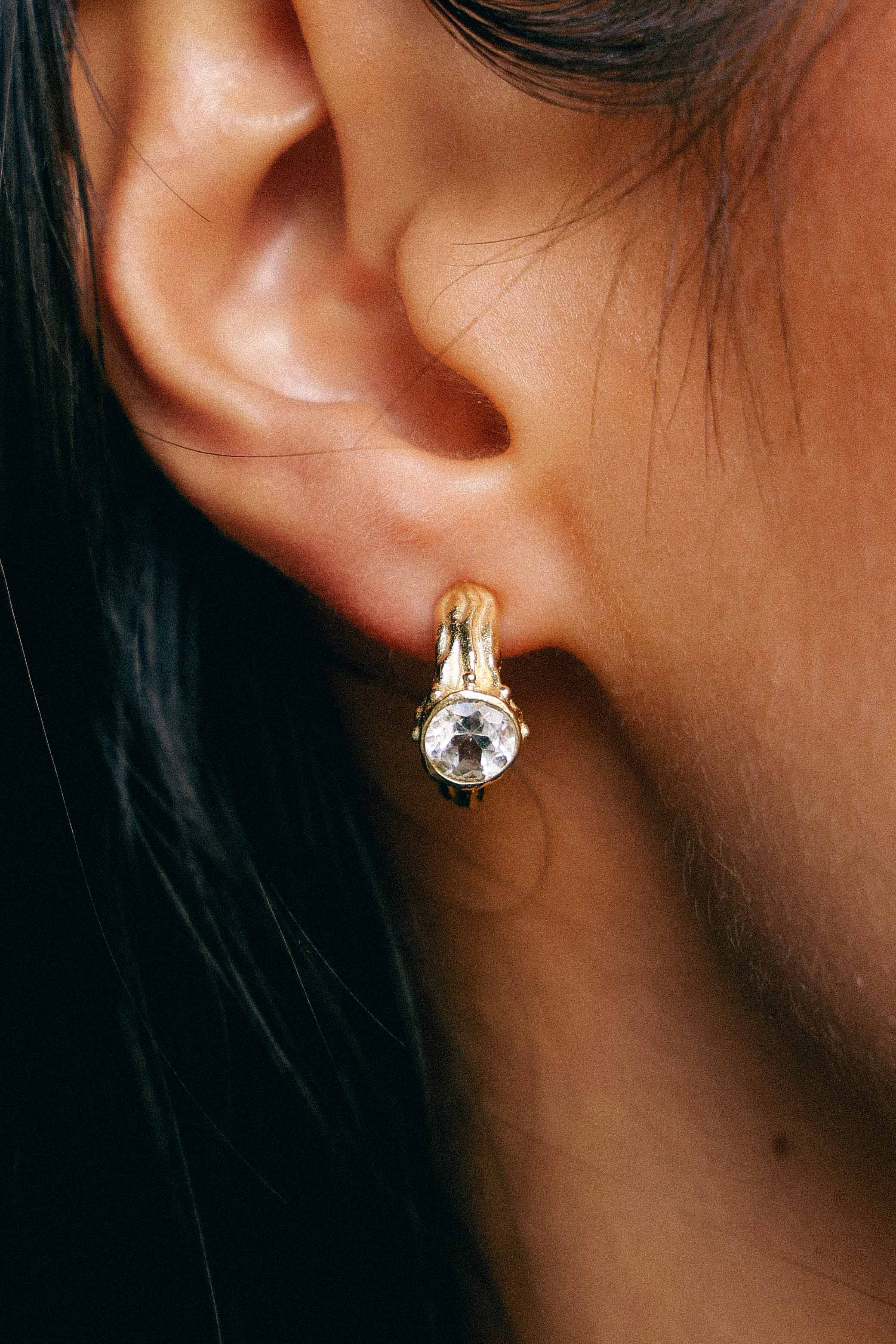 AROS SELES ORO Y TOPACIO BLANCO