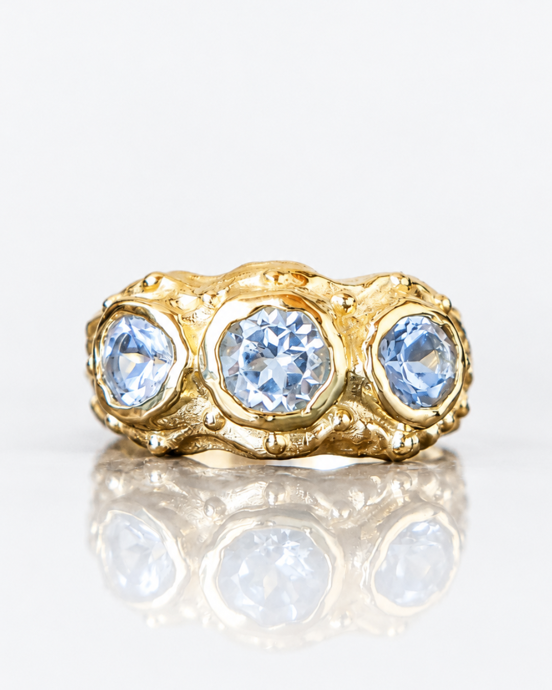 ANILLO SOLENE ORO Y TOPACIOS CELESTES