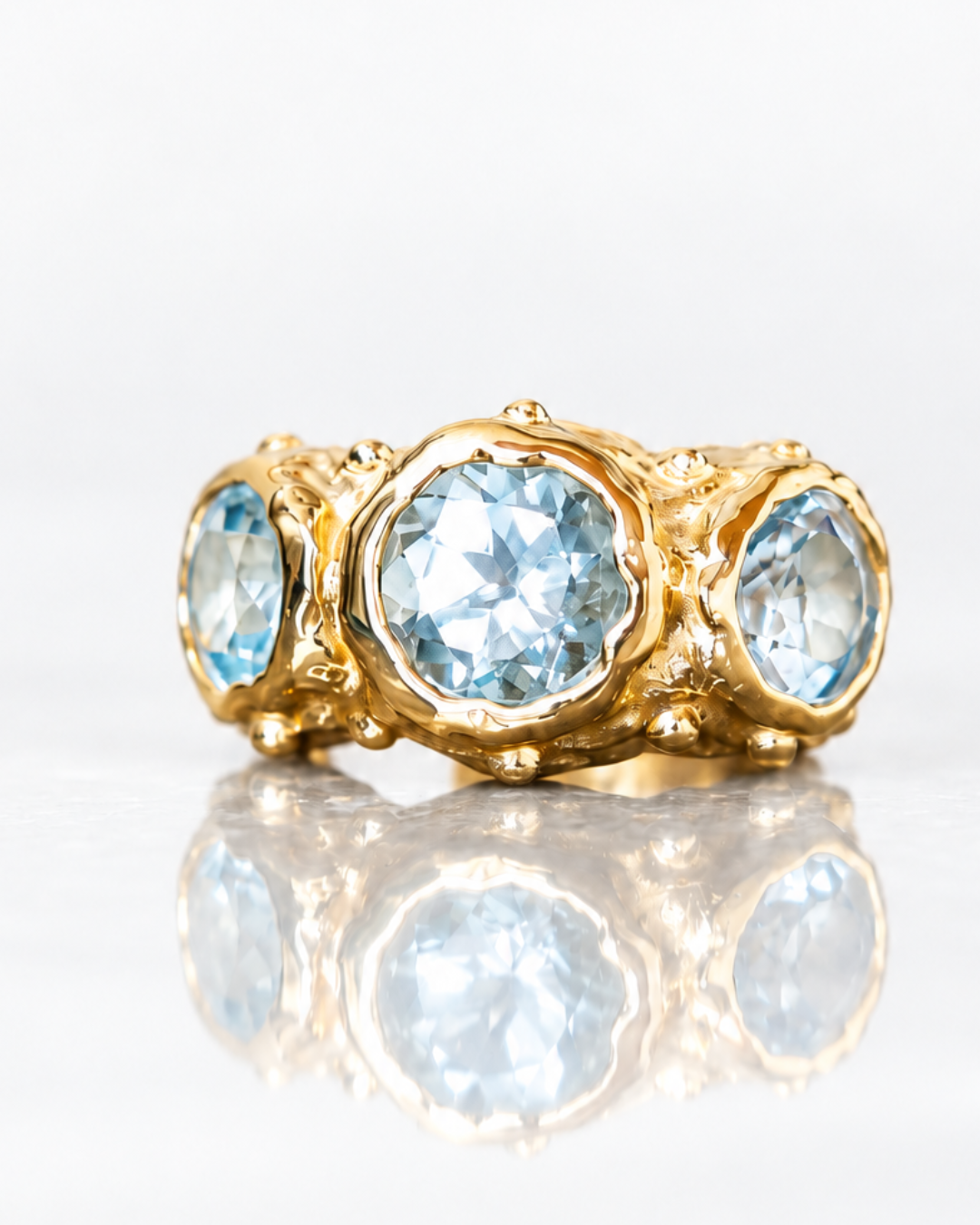 ARO EARCUFF SOLENE ORO Y TOPACIO CELESTE