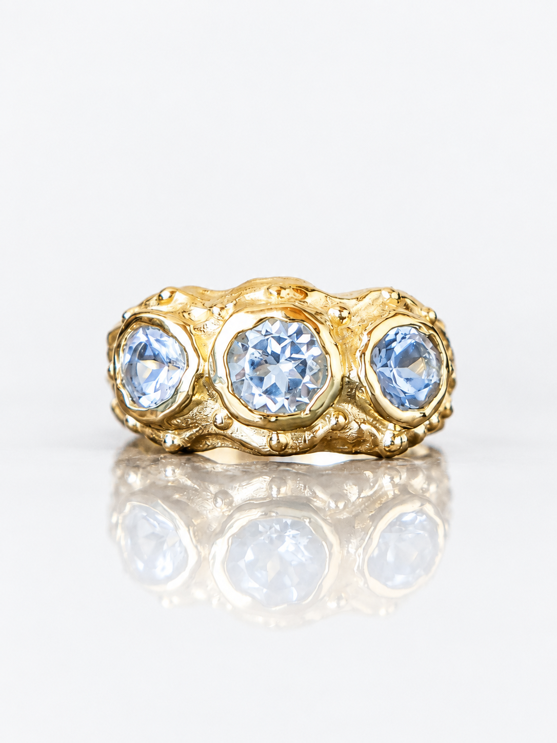 ANILLO SOLENE ORO Y TOPACIOS CELESTES