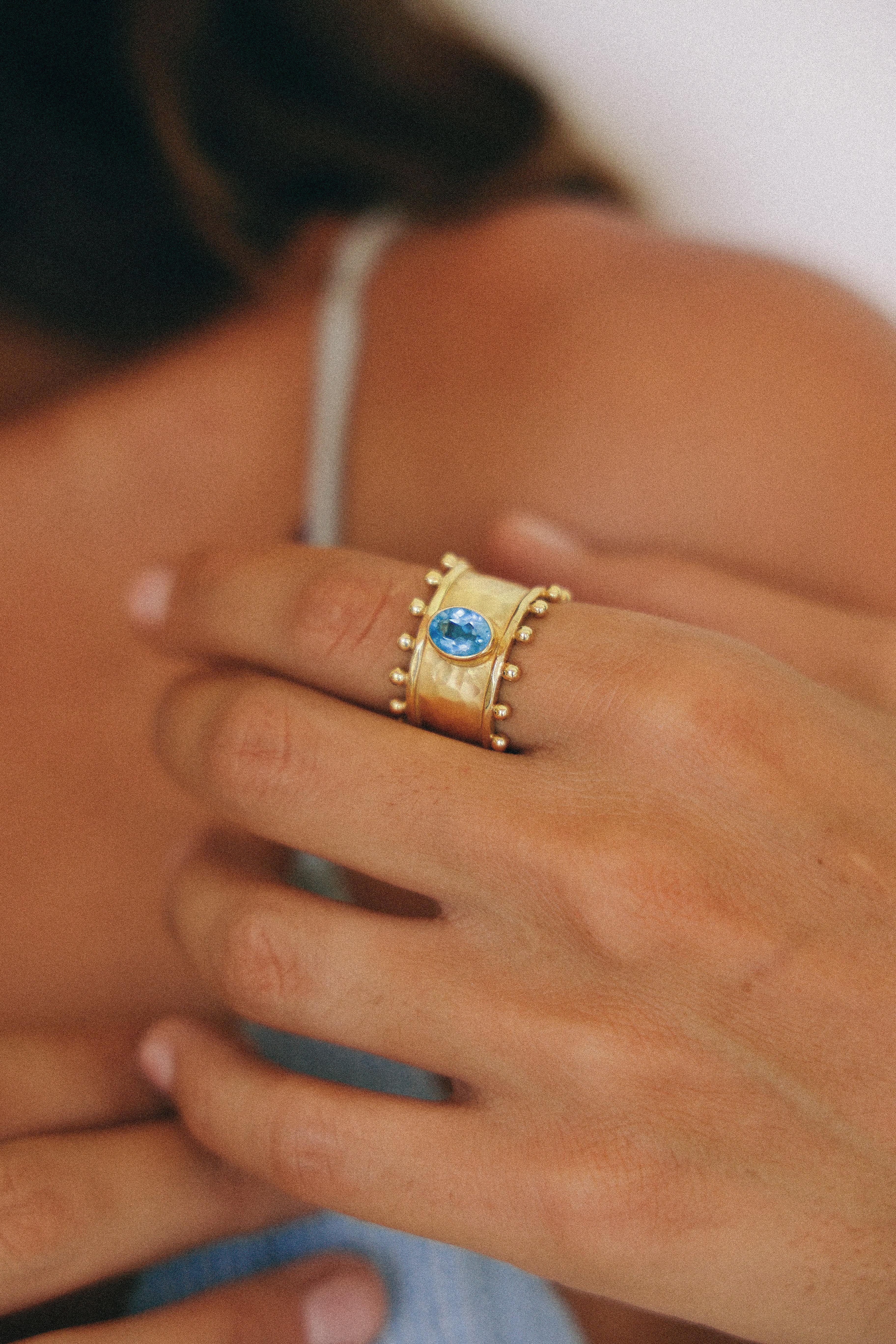 ANILLO ETER GOLD Y SWISS TOPACIO CELESTE